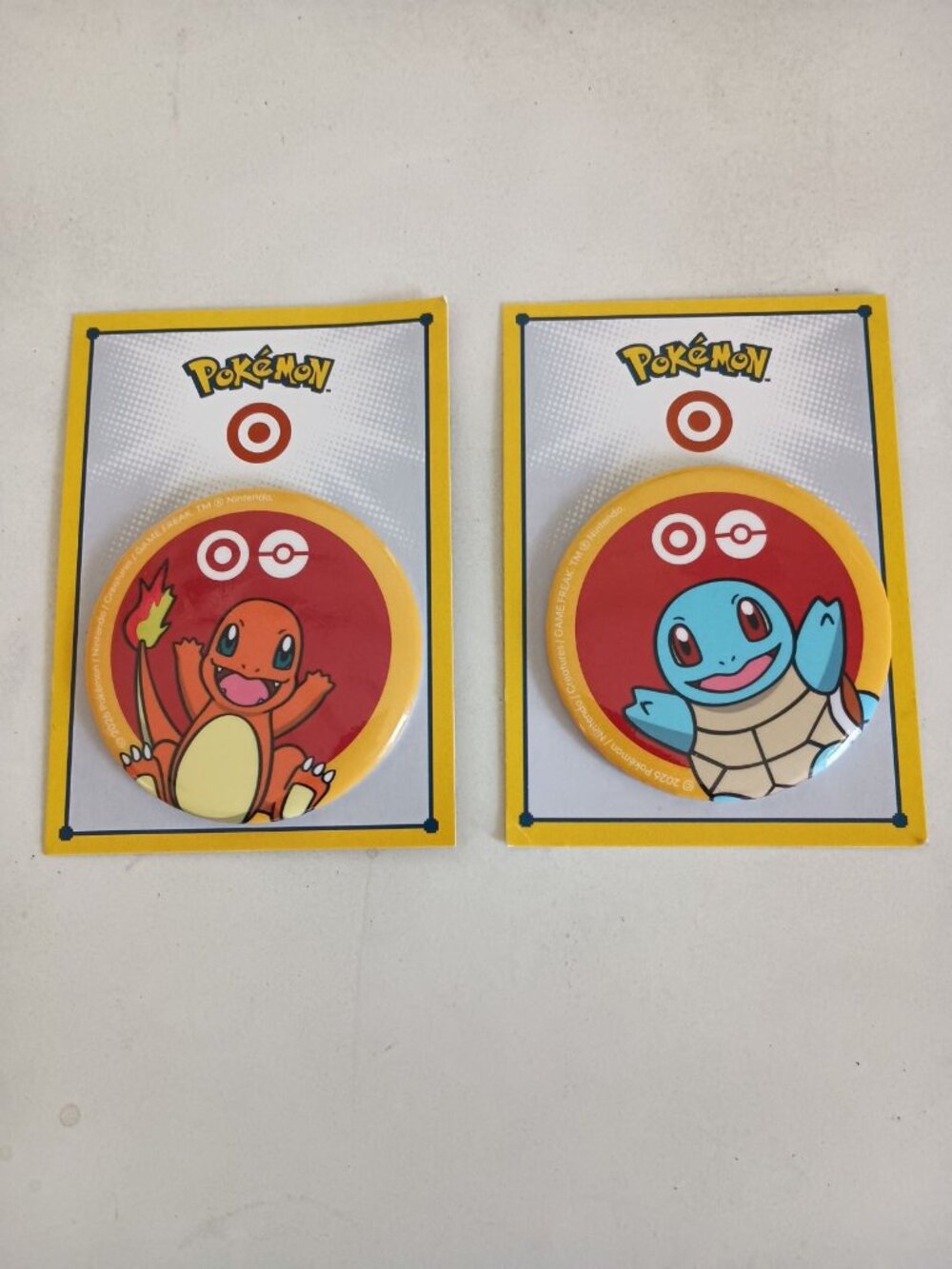 Target x Pokemon limited edition button pins Charmander and Squirtle